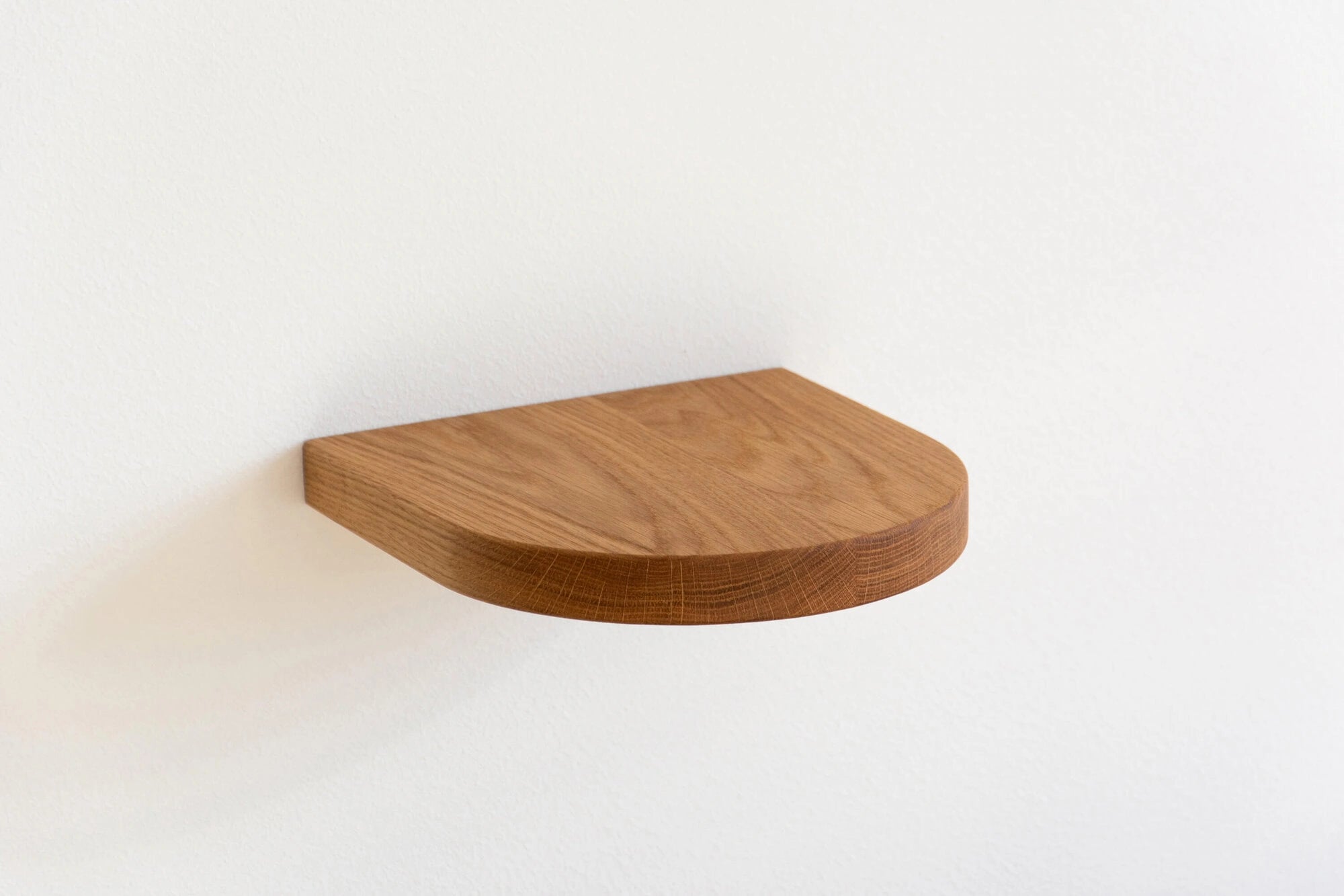 arch floating shelf made of oak