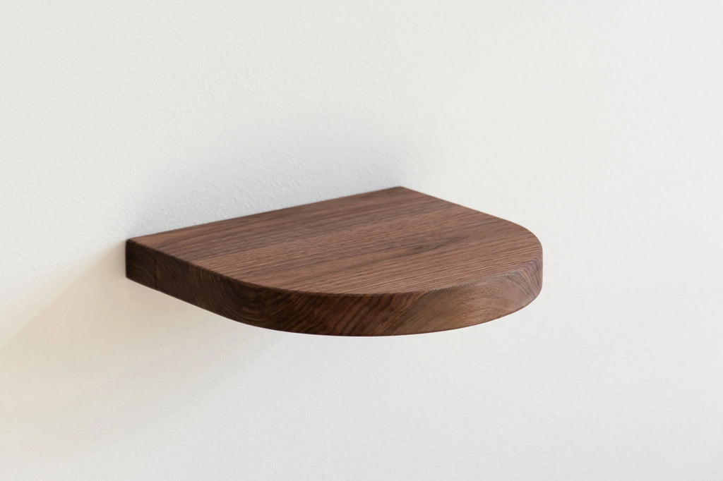 round floating shelf made of walnut
