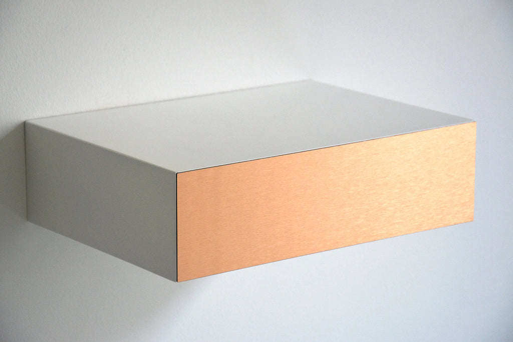 floating bedside table with copper drawer