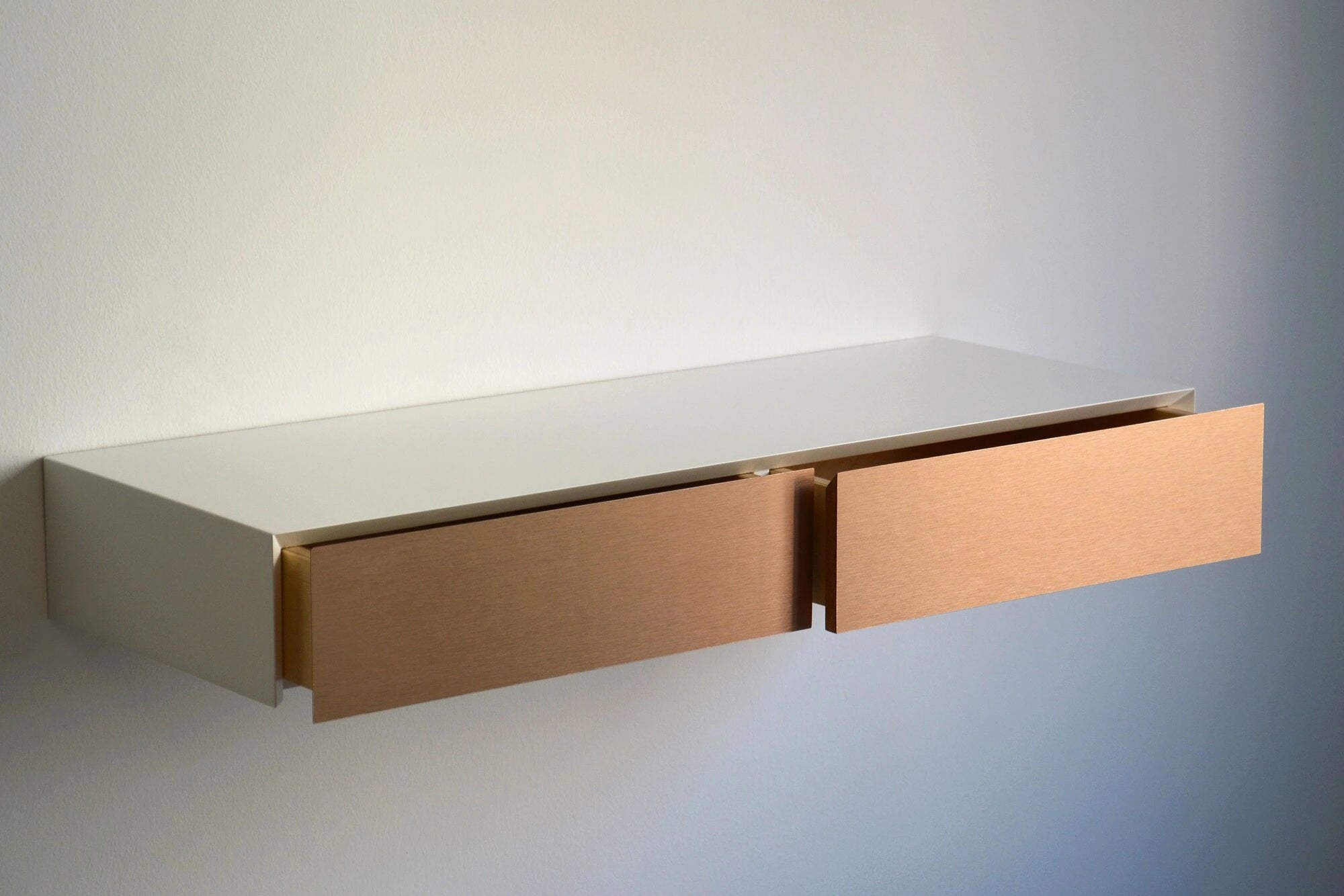 floating dressing table with copper drawers