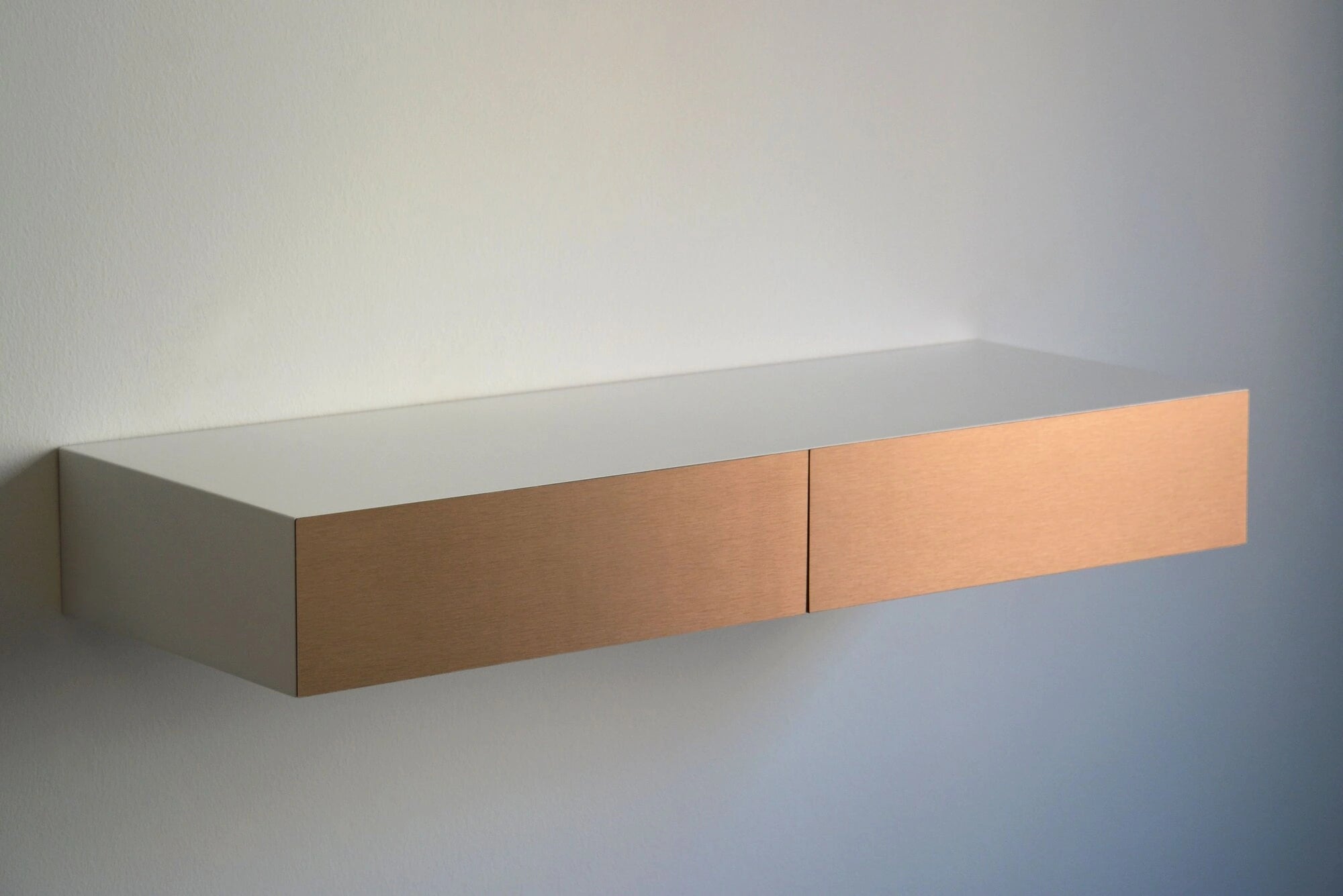 floating dressing table with copper drawers