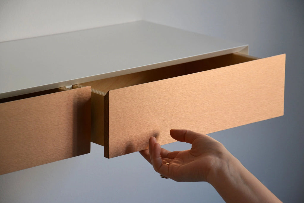 floating dressing vanity with copper drawers