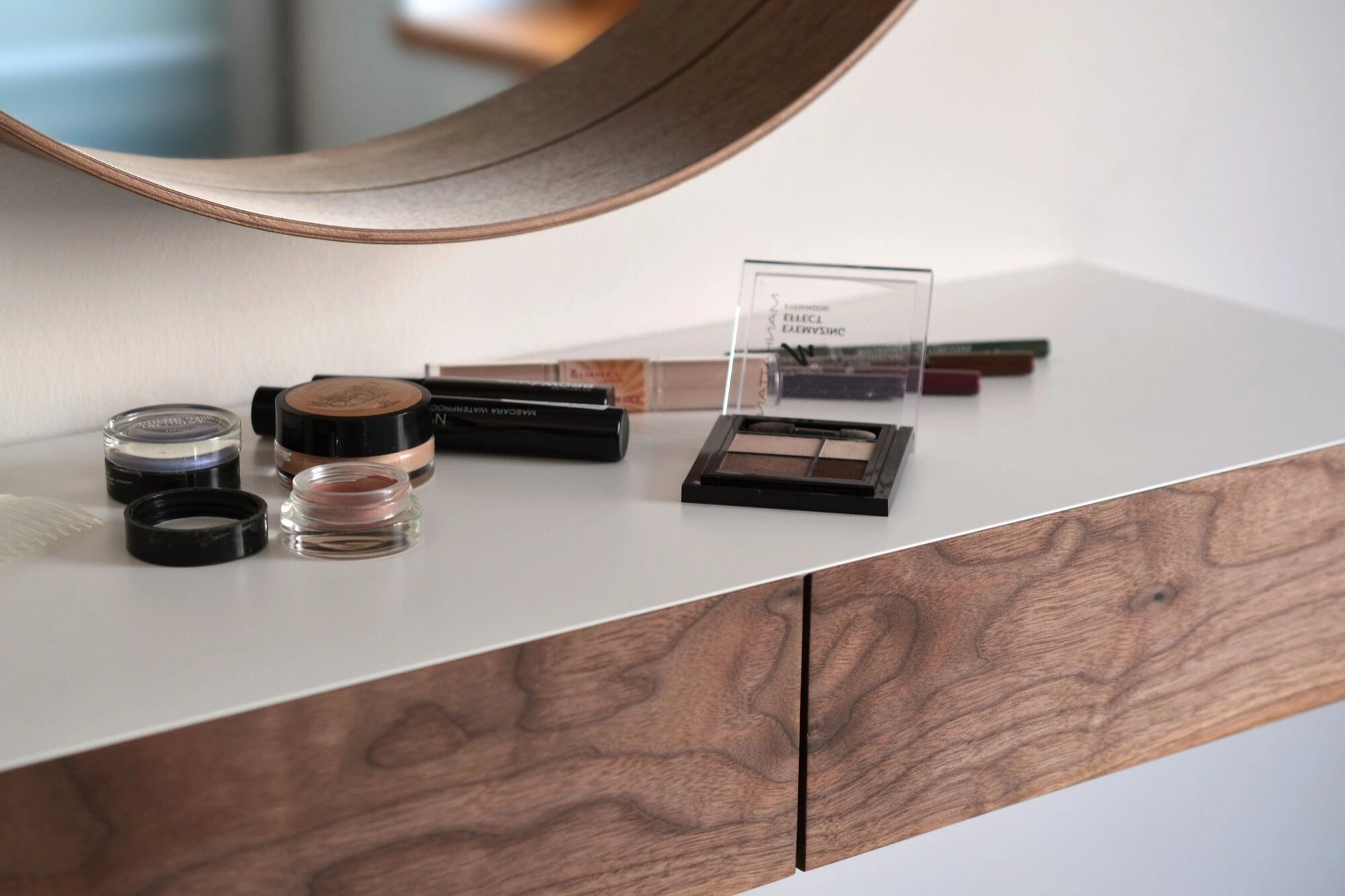 floating makeup shelf with walnut drawers