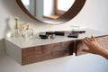 floating makeup shelf with walnut drawers