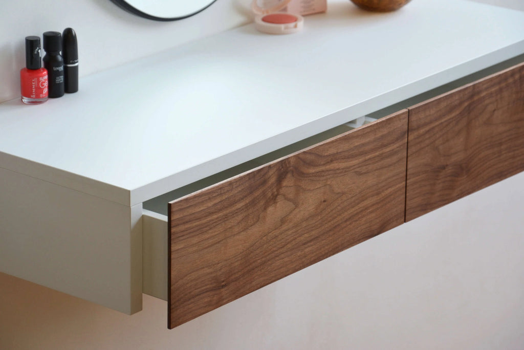 floating makeup vanity with walnut drawers