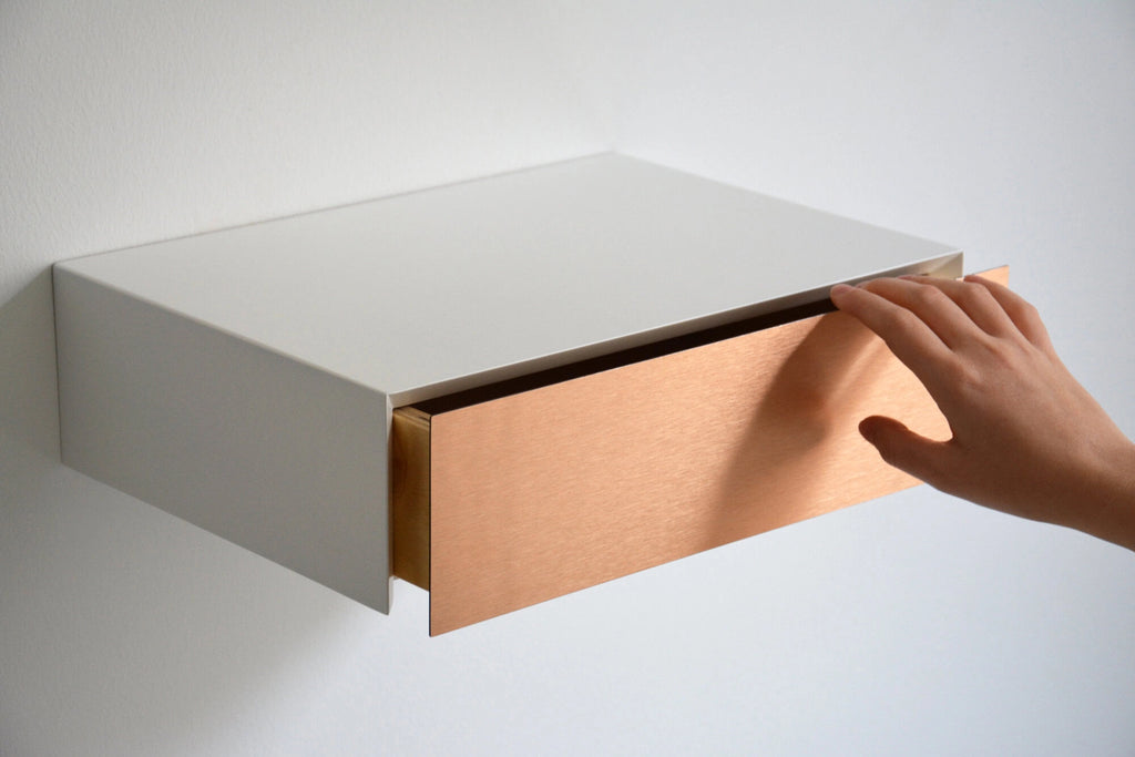 floating nightstand with copper drawer