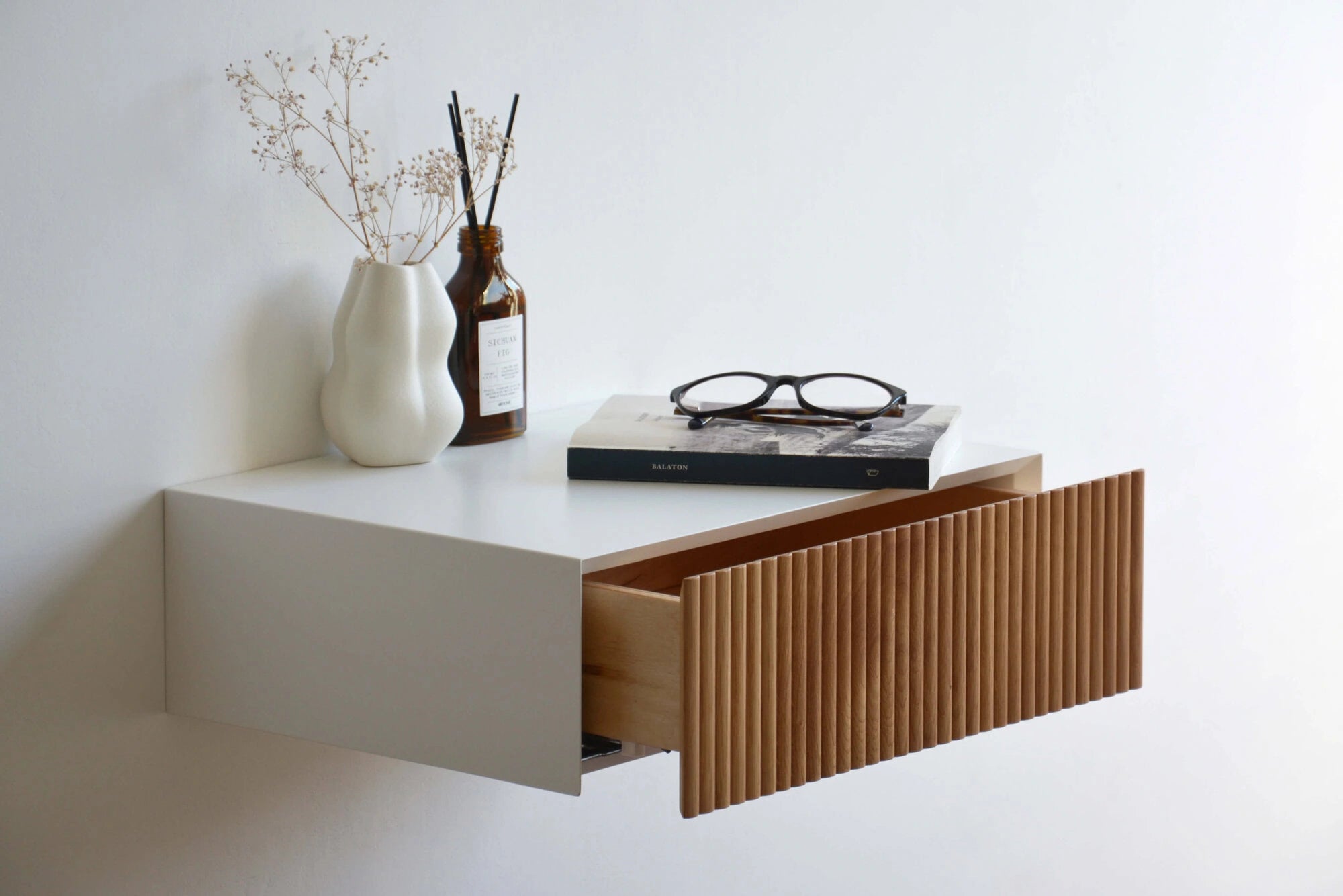 floating nightstand with fluted oak drawer