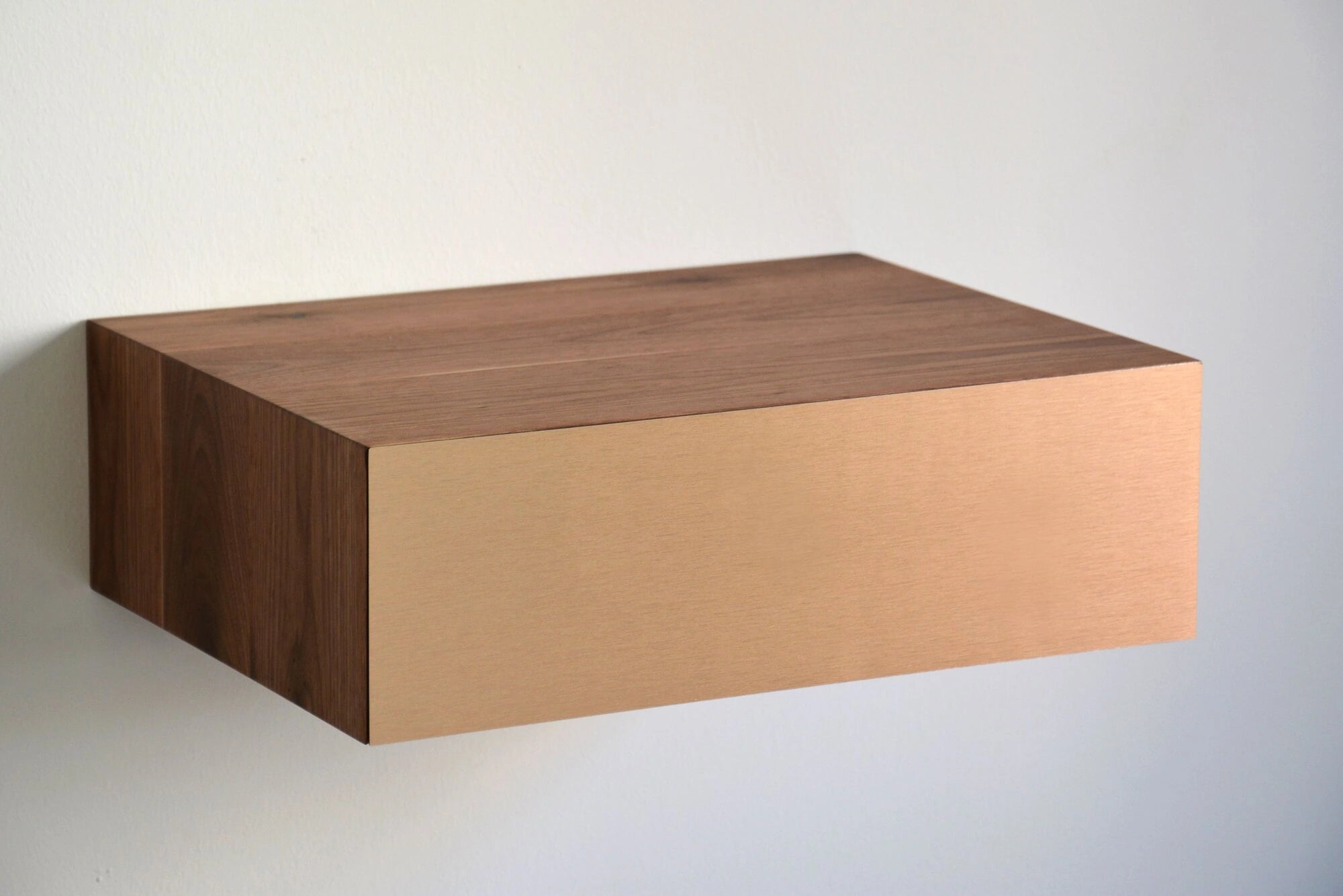 floating bedside table with copper drawer
