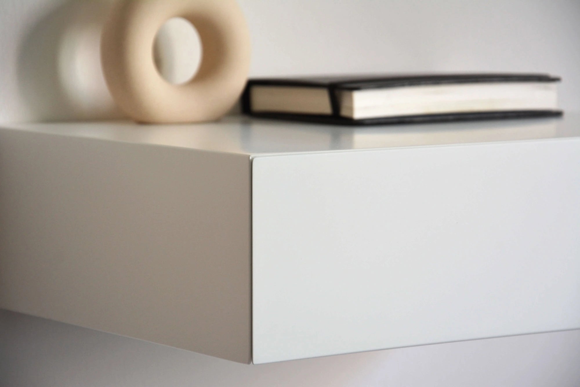 minimalist white floating nightstand