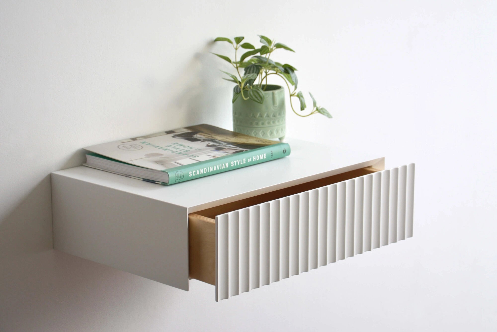 floating nightstand with fluted drawer