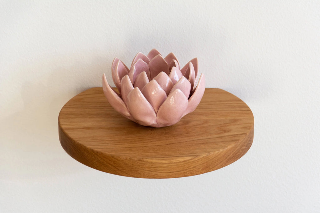 round floating shelf made of oak