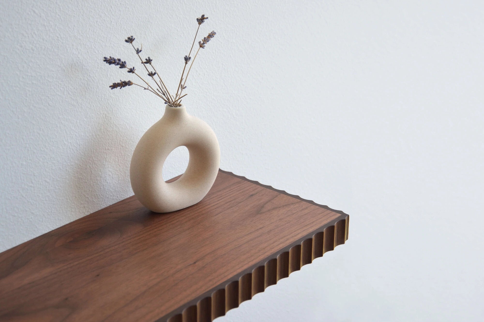 walnut wall shelf with fluted edges