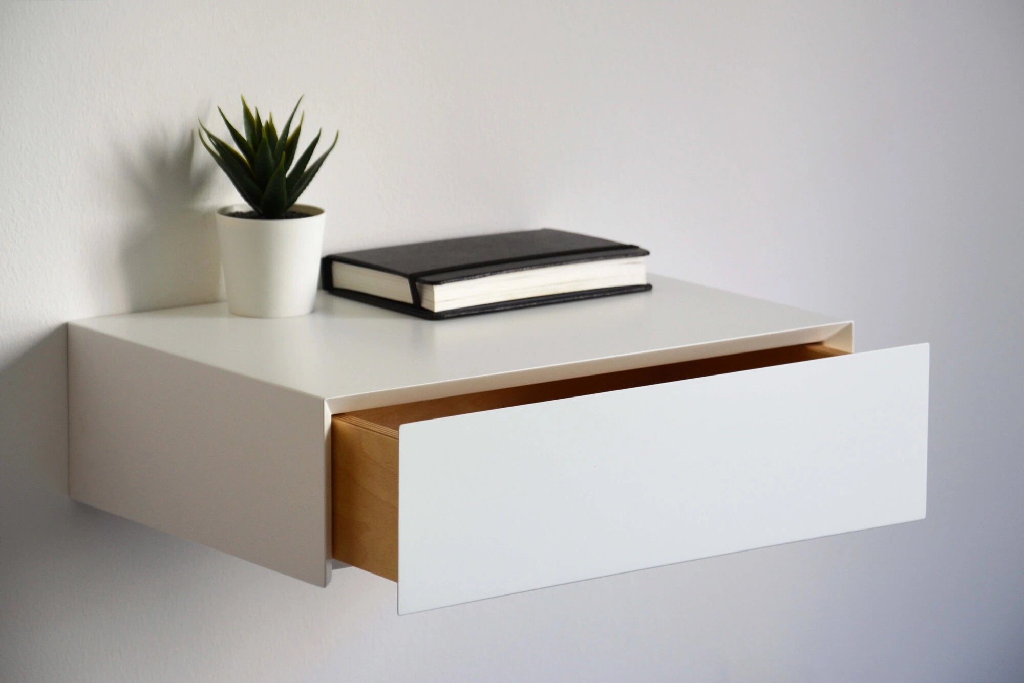 white floating nightstand