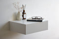 white fluted bedside table